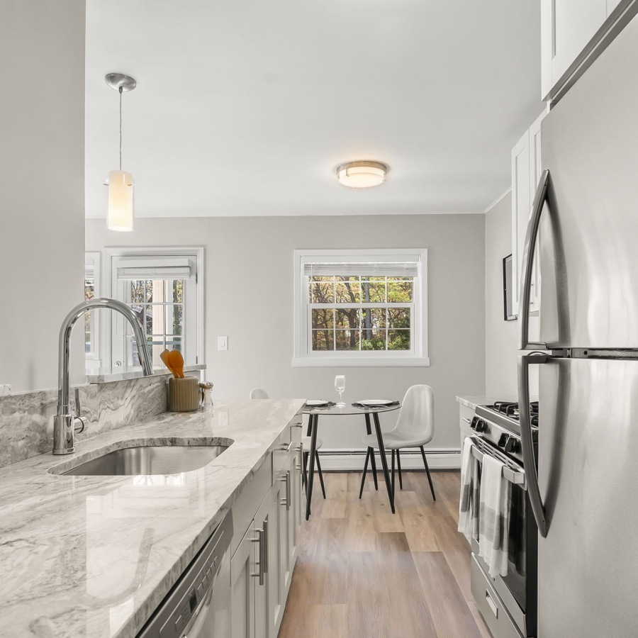 kitchen with ample counter-space, modern appliances and bright lighting